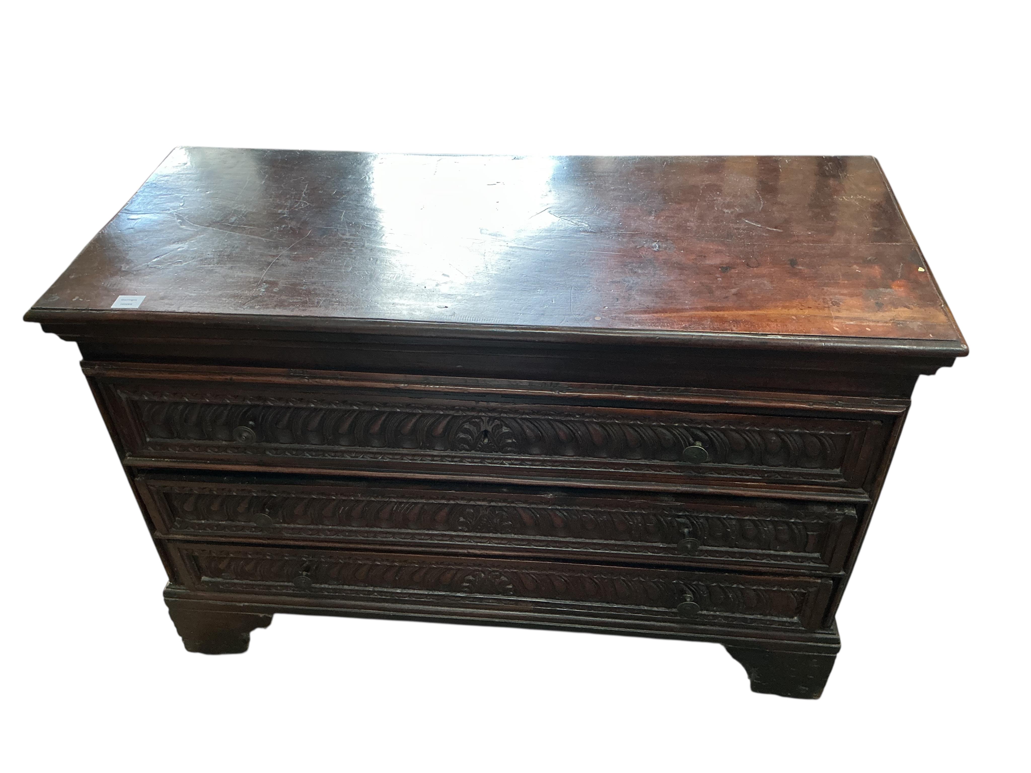 An 18th century Continental carved walnut chest, width 131cm, depth 56cm, height 88cm
